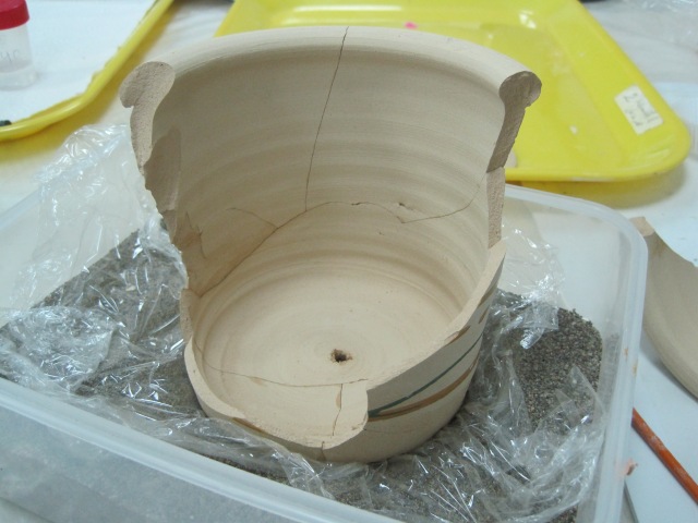 Gluing sherds together.